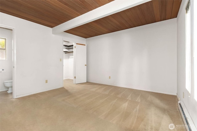 7633 NE 123rd St, Kirkland, WA 98034 - unfurnished bedroom with a baseboard radiator, carpet flooring, a wood ceiling with exposed beams, connected bathroom, and a walk in closet