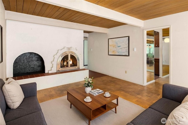 7633 NE 123rd St, Kirkland, WA 98034 - living room featuring a warm lit fireplace and a wooden ceiling with exposed beams