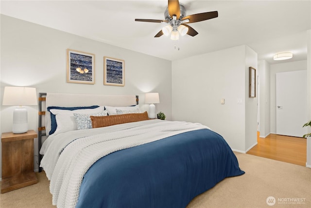 1400 Taylor Ave N Unit 203, Seattle, WA 98109 - bedroom featuring light colored carpet, ceiling fan, and baseboards