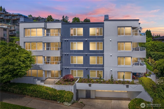 1400 Taylor Ave N Unit 203, Seattle, WA 98109 - view of apartment building / complex with a garage and driveway