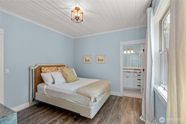 33 N Glen Ln, Pacific Beach, WA 98571 - bedroom featuring wood finished floors, baseboards, crown molding, a sink, and wooden ceiling
