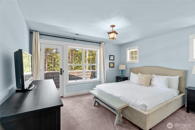33 N Glen Ln, Pacific Beach, WA 98571 - bedroom with light carpet, access to outside, and baseboards