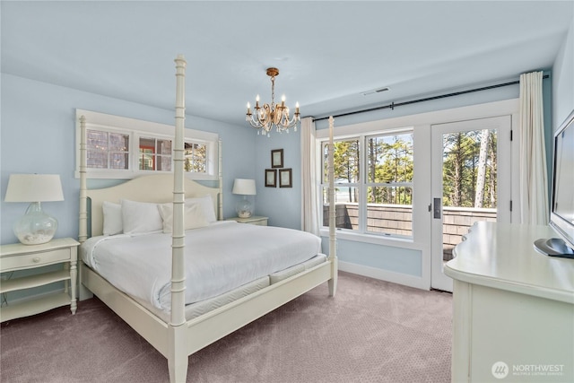 33 N Glen Ln, Pacific Beach, WA 98571 - bedroom featuring access to outside, light carpet, a chandelier, and baseboards