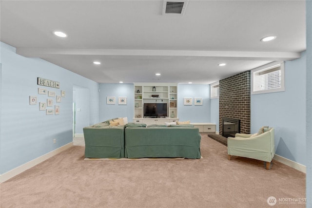 33 N Glen Ln, Pacific Beach, WA 98571 - living room featuring light carpet, recessed lighting, a brick fireplace, and baseboards
