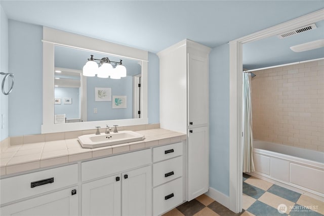 33 N Glen Ln, Pacific Beach, WA 98571 - bathroom featuring vanity, shower / bath combo with shower curtain, and tile patterned floors