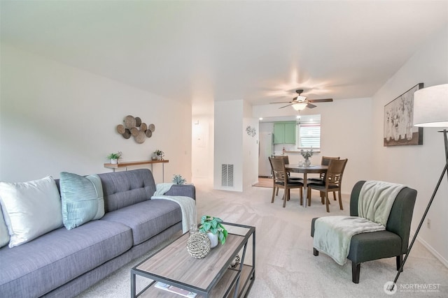22002 SE 40th Ln Unit 1111, Issaquah, WA 98029 - living area featuring light carpet and a ceiling fan