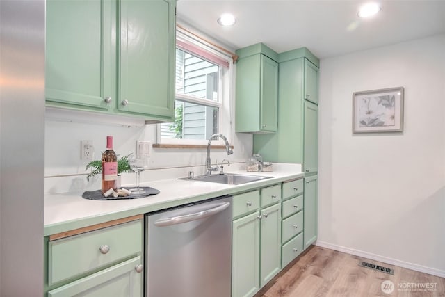 22002 SE 40th Ln Unit 1111, Issaquah, WA 98029 - kitchen with dishwasher, a sink, green cabinets, light countertops, and recessed lighting