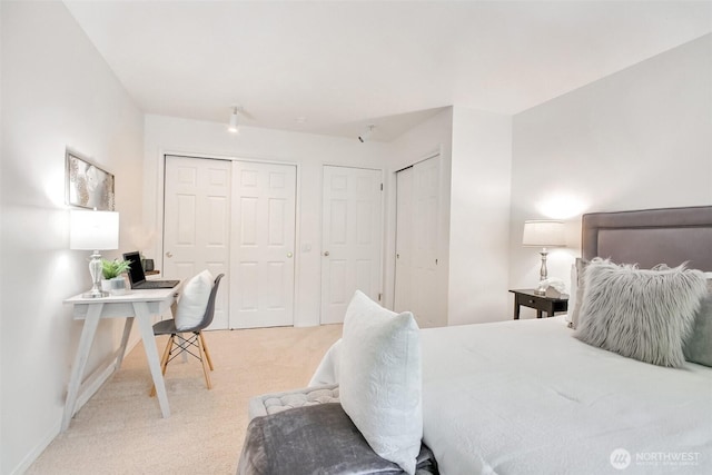 22002 SE 40th Ln Unit 1111, Issaquah, WA 98029 - carpeted bedroom with multiple closets, an office area, and baseboards
