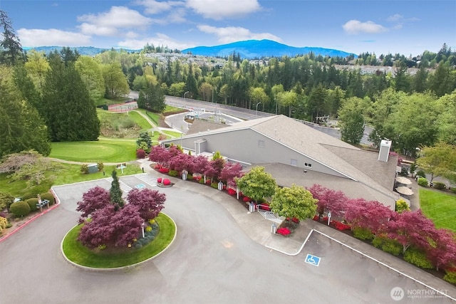 22002 SE 40th Ln Unit 1111, Issaquah, WA 98029 - drone / aerial view of a mountain backdrop and a heavily wooded area