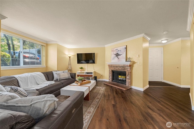 23410 18th Ave S Unit A102, Des Moines, WA 98198 - living room featuring wood finished floors, baseboards, a fireplace, a textured ceiling, and crown molding