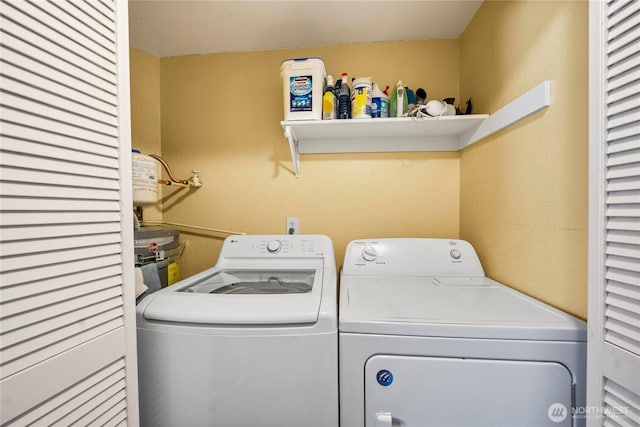 23410 18th Ave S Unit A102, Des Moines, WA 98198 - washroom featuring washer and clothes dryer