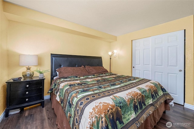 23410 18th Ave S Unit A102, Des Moines, WA 98198 - bedroom with wood finished floors, baseboards, and a closet