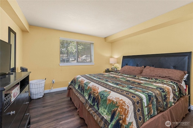 23410 18th Ave S Unit A102, Des Moines, WA 98198 - bedroom featuring dark wood-type flooring and baseboards
