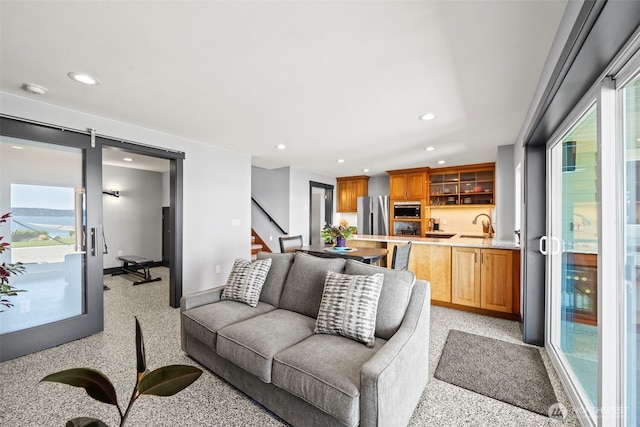 8210 Walnut Rd NE, Olympia, WA 98516 - living area featuring recessed lighting, healthy amount of natural light, stairs, baseboards, and a barn door