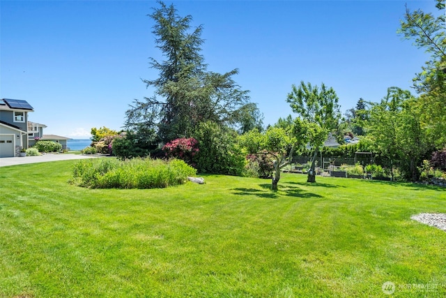 8210 Walnut Rd NE, Olympia, WA 98516 - view of grassy yard featuring a garage