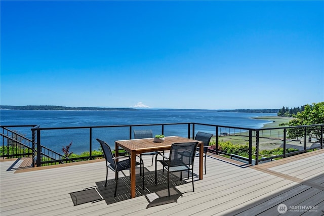 8210 Walnut Rd NE, Olympia, WA 98516 - wooden deck with a water view and outdoor dining area