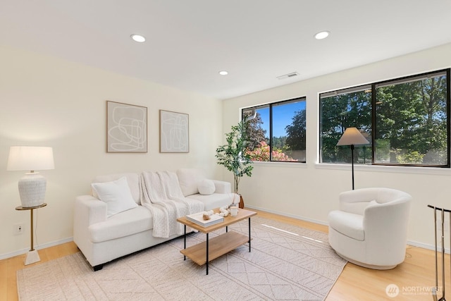 9930 NE 144th Ln Unit 206, Kirkland, WA 98034 - living room featuring wood finished floors, recessed lighting, and baseboards