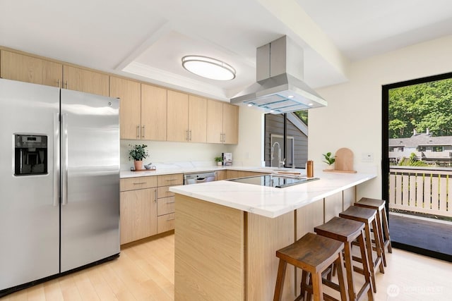 9930 NE 144th Ln Unit 206, Kirkland, WA 98034 - kitchen featuring stainless steel appliances, light brown cabinetry, island exhaust hood, and a peninsula