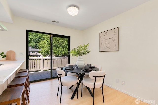 9930 NE 144th Ln Unit 206, Kirkland, WA 98034 - dining room with light wood-style floors and baseboards