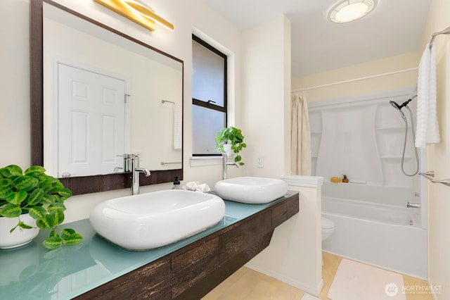 9930 NE 144th Ln Unit 206, Kirkland, WA 98034 - bathroom with double vanity, shower / bath combination with curtain, and toilet