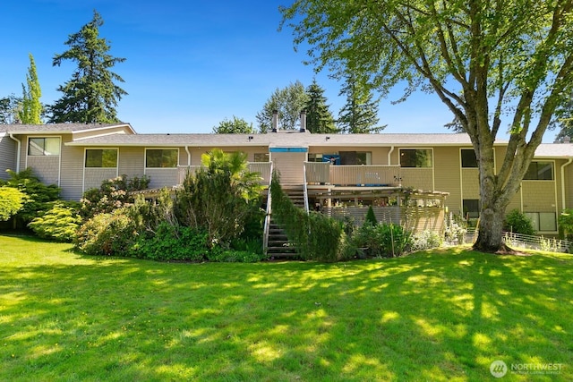 9930 NE 144th Ln Unit 206, Kirkland, WA 98034 - rear view of house with stairs, a lawn, and a wooden deck