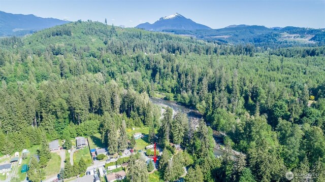 20215 Crystal Springs Dr, Granite Falls, WA 98252 - aerial overview of property's location with a heavily wooded area and a mountain backdrop