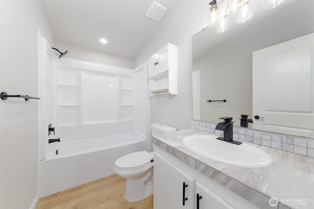20215 Crystal Springs Dr, Granite Falls, WA 98252 - full bathroom with wood finished floors, vanity, toilet, shower / tub combination, and recessed lighting