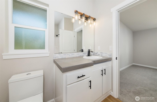 20215 Crystal Springs Dr, Granite Falls, WA 98252 - bathroom featuring vanity, toilet, tasteful backsplash, and baseboards