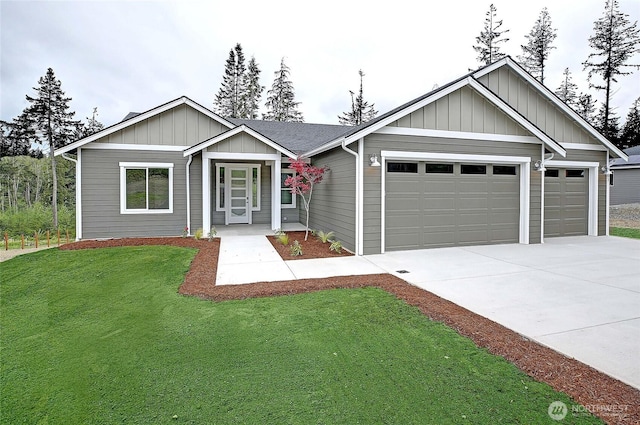 161 N Camano Ridge Rd, Camano Island, WA 98282 - ranch-style house with a garage, concrete driveway, board and batten siding, and a front yard
