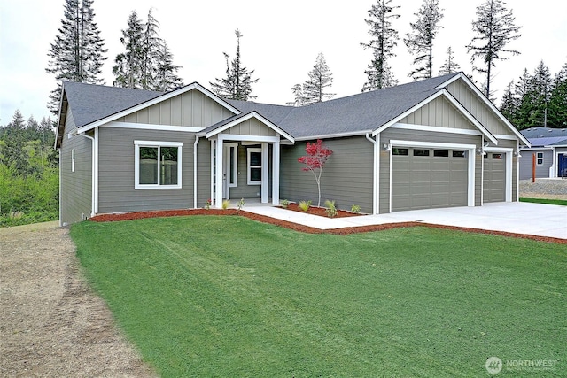 161 N Camano Ridge Rd, Camano Island, WA 98282 - ranch-style home featuring a garage, concrete driveway, board and batten siding, a front lawn, and a shingled roof
