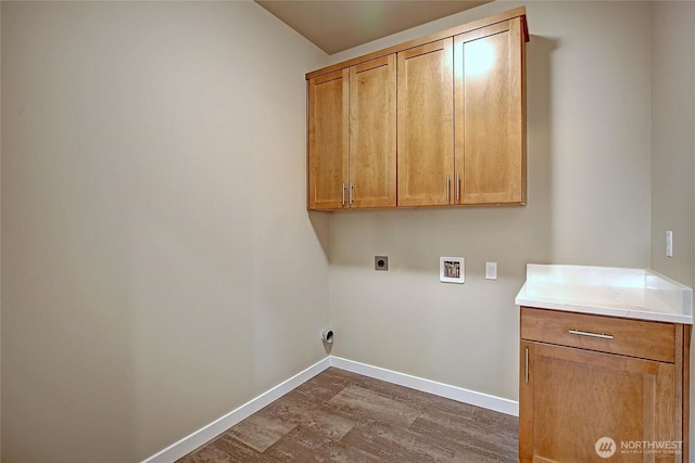161 N Camano Ridge Rd, Camano Island, WA 98282 - washroom featuring washer hookup, electric dryer hookup, dark wood-style floors, cabinet space, and baseboards