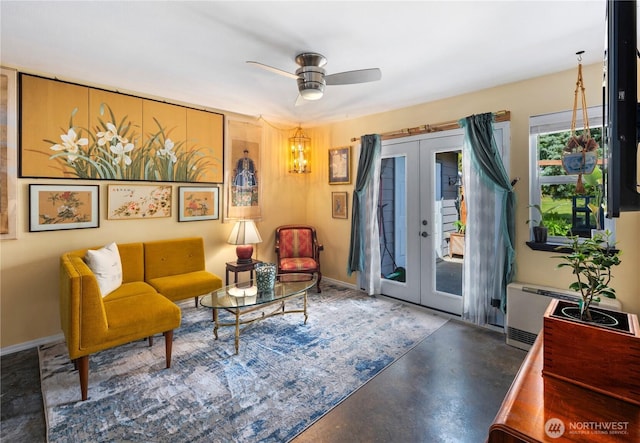 3376 New Hope Cir, Bremerton, WA 98312 - sitting room with french doors, a ceiling fan, and concrete flooring