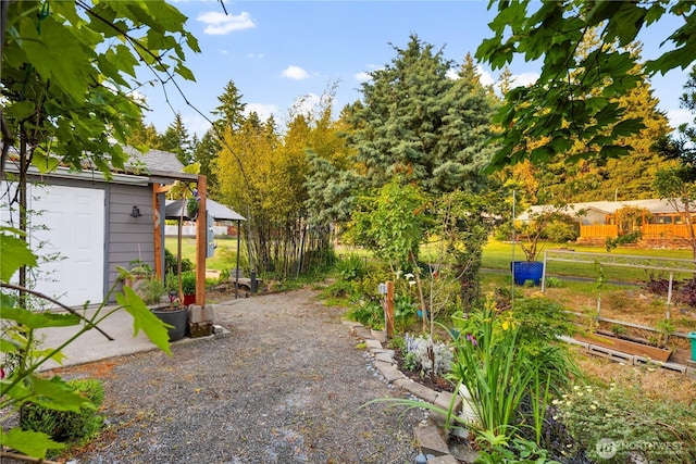 3376 New Hope Cir, Bremerton, WA 98312 - view of yard with a garden and an outdoor structure