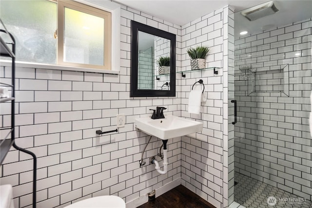 8414 9th Ave SW, Seattle, WA 98106 - full bath with a shower stall, tile walls, and toilet