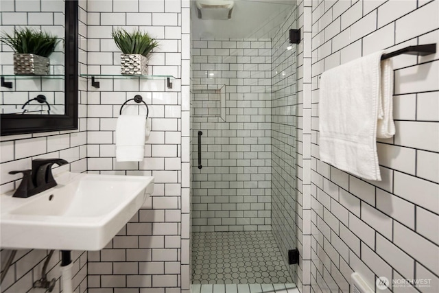 8414 9th Ave SW, Seattle, WA 98106 - bathroom with tile walls, a shower stall, and a sink