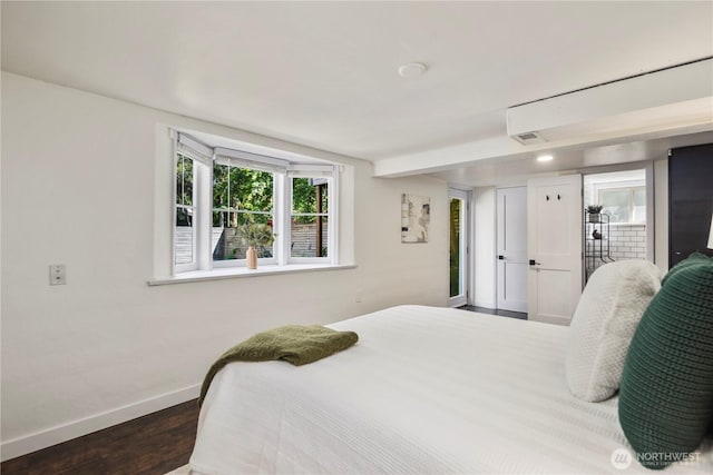 8414 9th Ave SW, Seattle, WA 98106 - bedroom featuring baseboards, wood finished floors, and multiple windows
