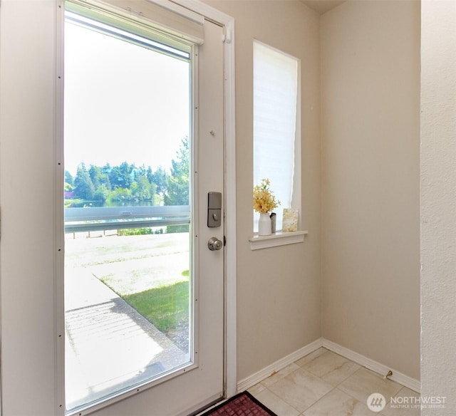 2311 Milton Way Unit F, Milton, WA 98354 - doorway featuring plenty of natural light and baseboards