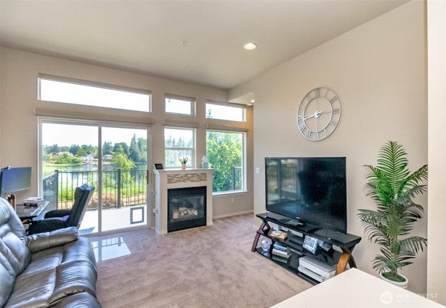 2311 Milton Way Unit F, Milton, WA 98354 - carpeted living area featuring a glass covered fireplace and recessed lighting