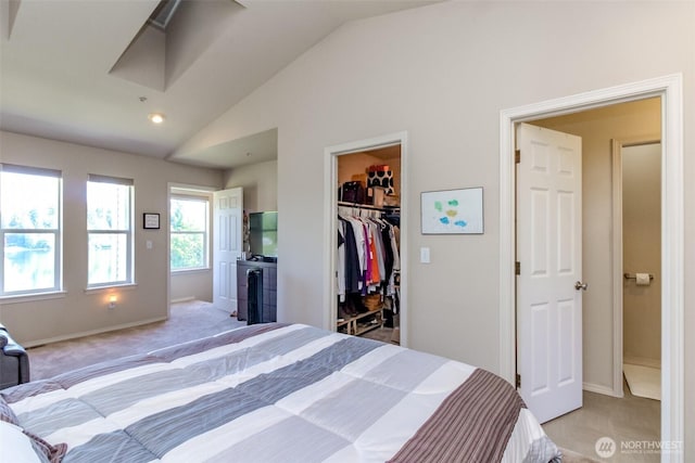 2311 Milton Way Unit F, Milton, WA 98354 - bedroom featuring vaulted ceiling, a spacious closet, baseboards, a closet, and light colored carpet