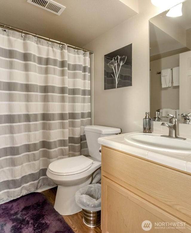 2311 Milton Way Unit F, Milton, WA 98354 - bathroom with toilet, vanity, and a shower with curtain