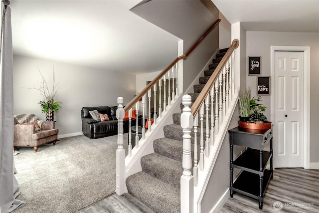 11608 SE 228th Pl, Kent, WA 98031 - stairway featuring wood finished floors and baseboards