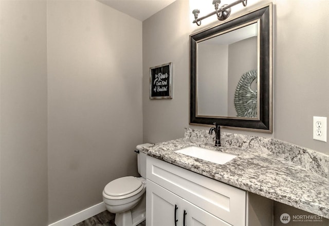 11608 SE 228th Pl, Kent, WA 98031 - bathroom featuring vanity, toilet, wood finished floors, and baseboards