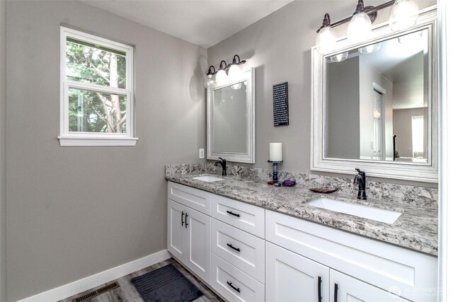 11608 SE 228th Pl, Kent, WA 98031 - bathroom featuring baseboards and double vanity