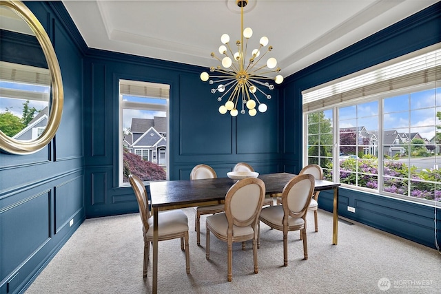 30101 129th Pl SE, Auburn, WA 98092 - dining space with a decorative wall, light carpet, a chandelier, and ornamental molding