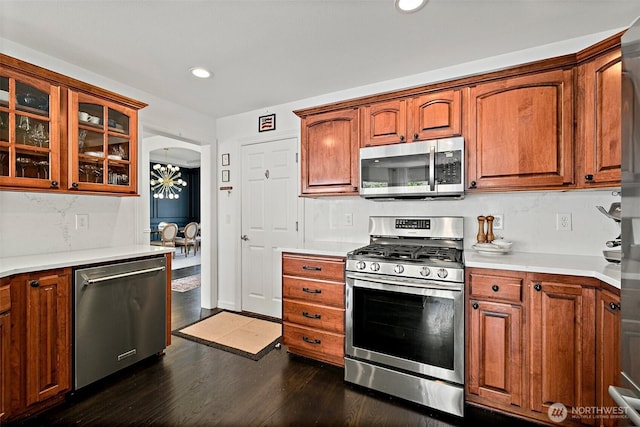 30101 129th Pl SE, Auburn, WA 98092 - kitchen with appliances with stainless steel finishes, glass insert cabinets, dark wood-style floors, light countertops, and recessed lighting