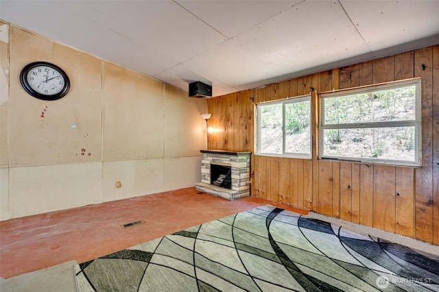 5530 Lewis River Rd, Ariel, WA 98603 - unfurnished living room with wood walls and a fireplace