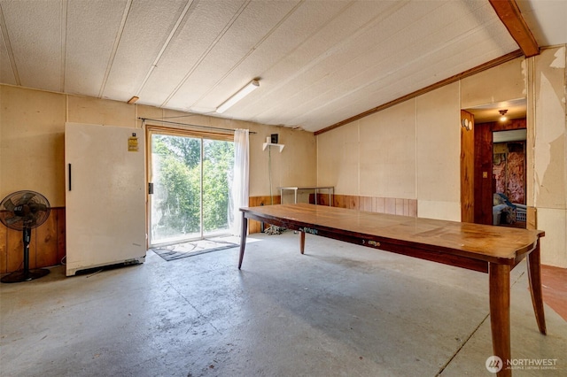 5530 Lewis River Rd, Ariel, WA 98603 - rec room with vaulted ceiling, concrete flooring, and wood walls
