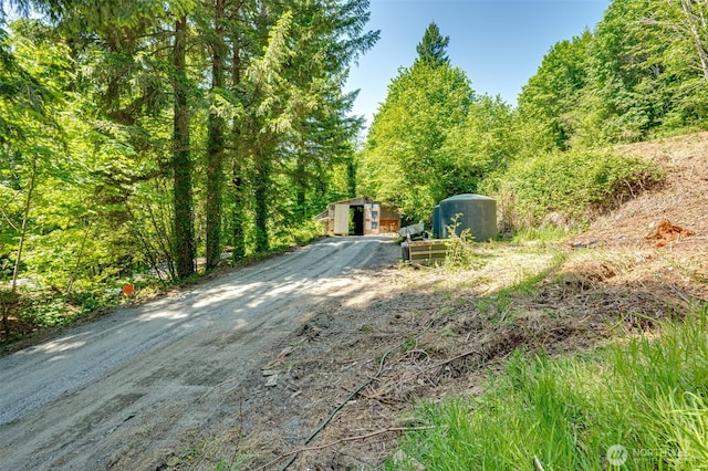 5530 Lewis River Rd, Ariel, WA 98603 - deck with driveway and a forest view