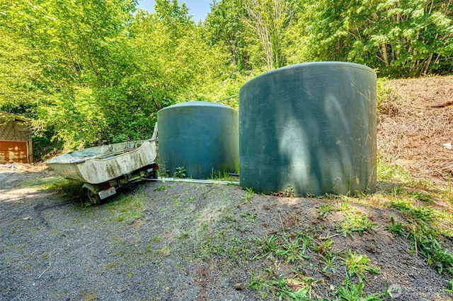 5530 Lewis River Rd, Ariel, WA 98603 - view of outbuilding featuring a wooded view