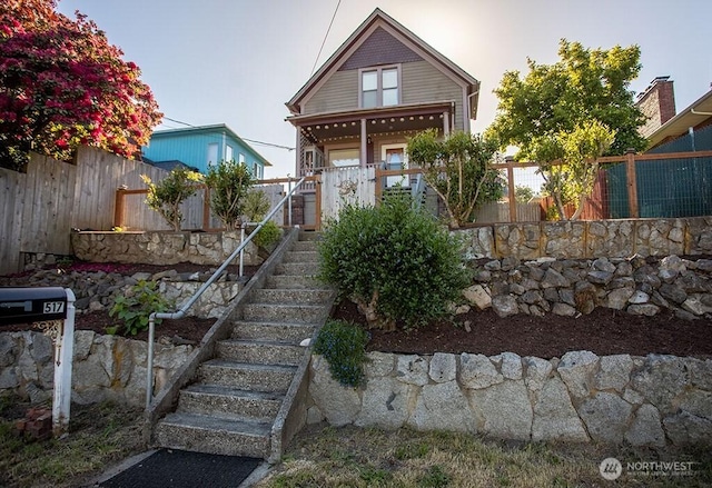 517 S Hartford Ave, Bremerton, WA 98312 - view of front of home with stairway and a porch